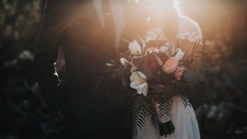 Modern wedding celebration with elegant floral decor and warm lighting