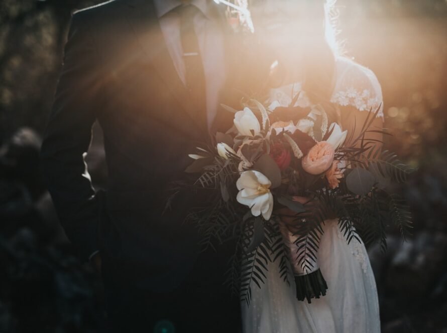 Modern wedding celebration with elegant floral decor and warm lighting
