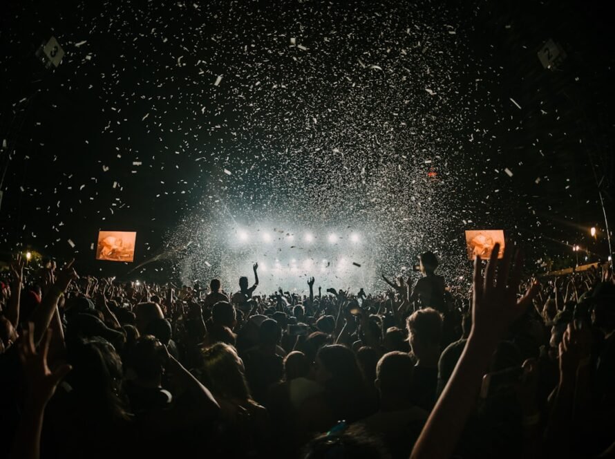 Festive night celebration with stage lighting and dancing crowd