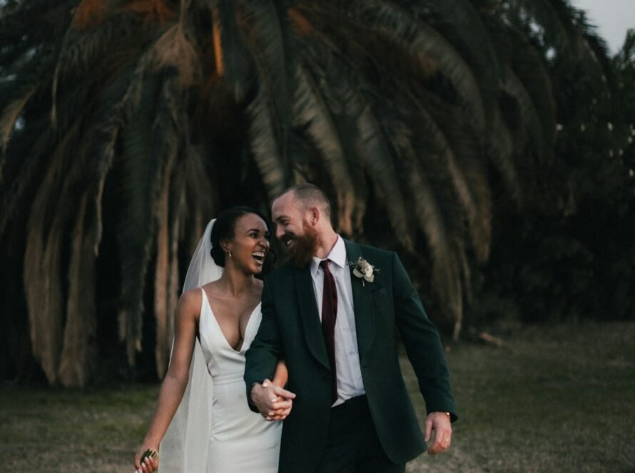 Wedding photographer capturing a couple during an outdoor ceremony